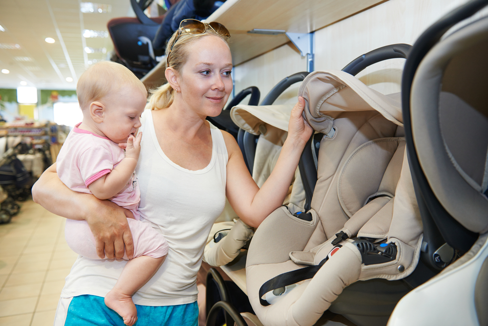 woman choosing child car seat at the target trade in car seat 2020