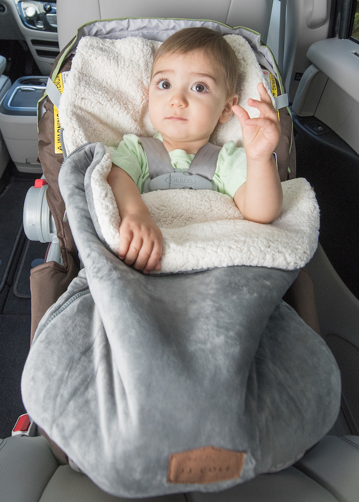 How To Keep Kids Warm In The Car Seat Safely Travel Mom - How To Put Car Seat Cover On Baby